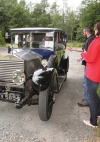 Getting the time card marked prior to leaving for the aftenoon run to the Bel Air hotel, Dick Smyth in his 1926 model twenty Rolls Royce take first place on the run