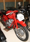 A bit of italian style stands out in red, the 62 Moto Guzzi Ladola belonging to M McNiffe